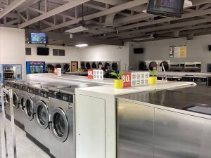 Interior of modern laundromat with washing machines