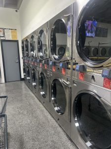 Interior of modern laundromat with washing machines