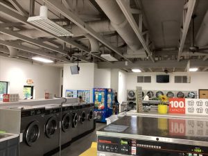 Interior of modern laundromat with washing machines
