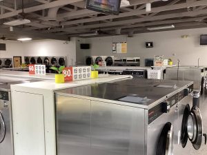 Interior of modern laundromat with washing machines