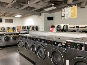 Interior of modern laundromat with washing machines