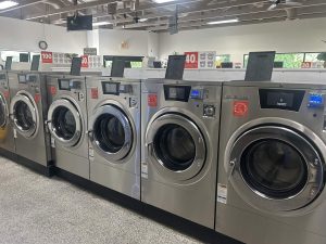 Interior of modern laundromat with washing machines